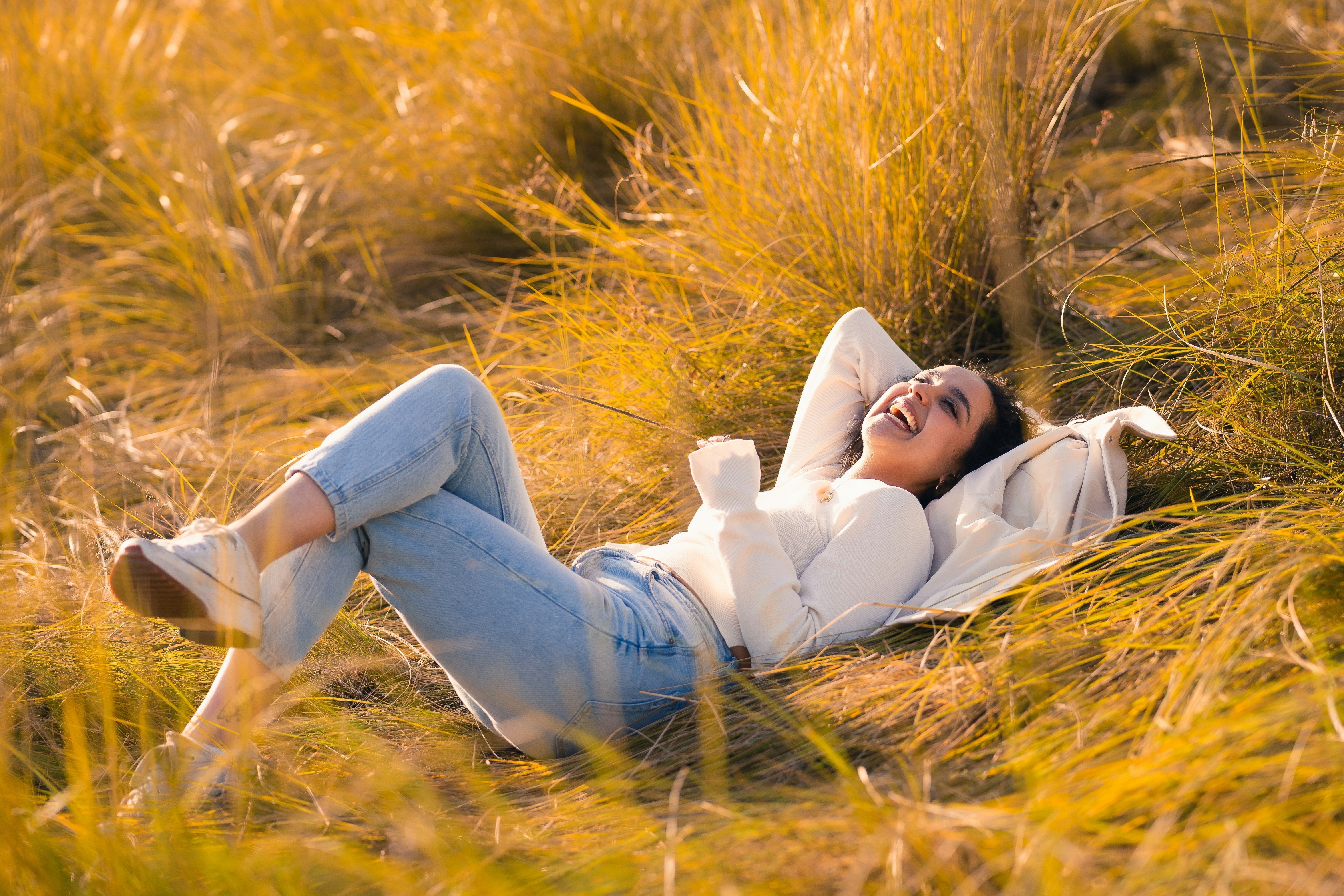 Relaxed person outdoors, symbolizing stress relief and emotional well-being